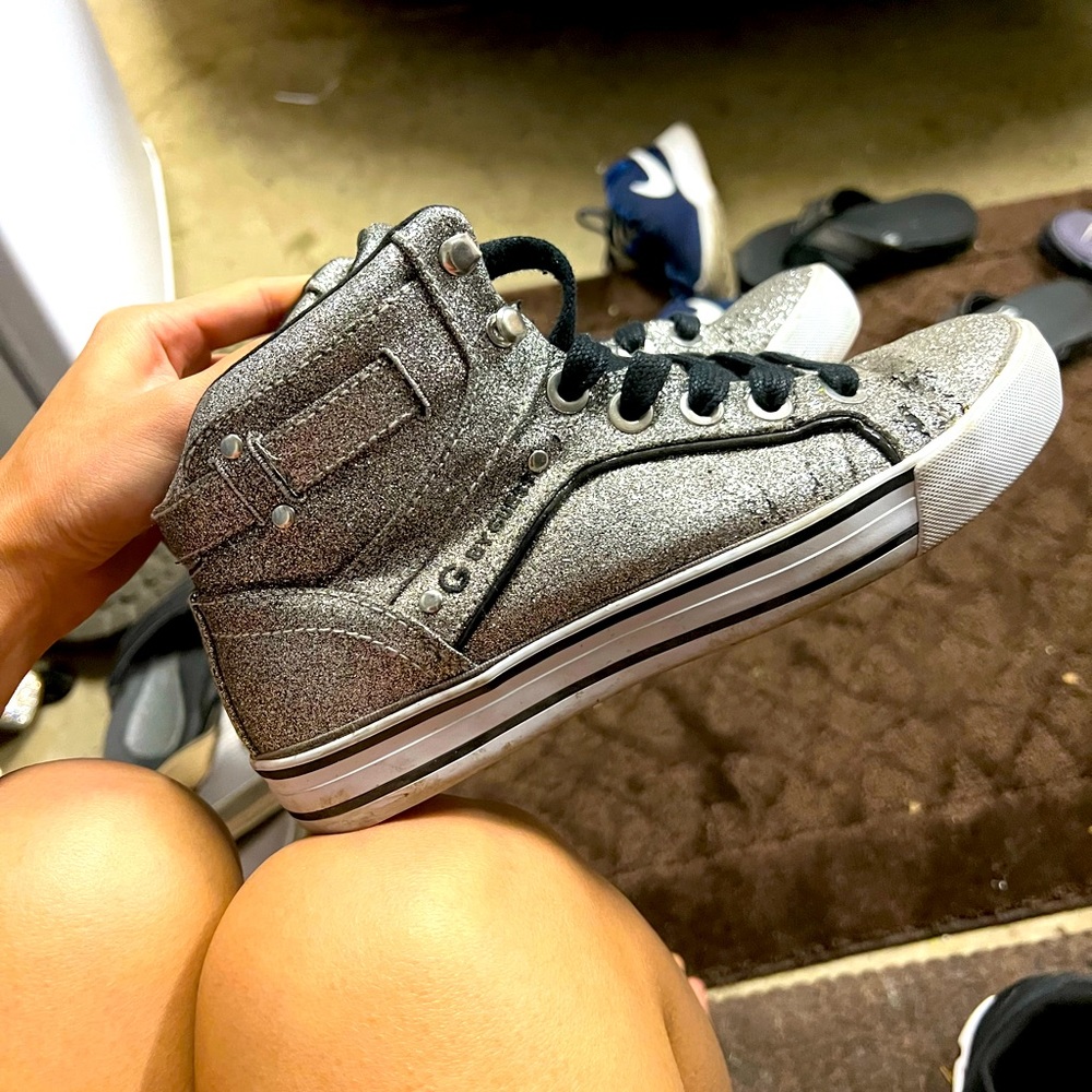 Silver high top Guess shoes. Little worn down, but still pretty good condition.